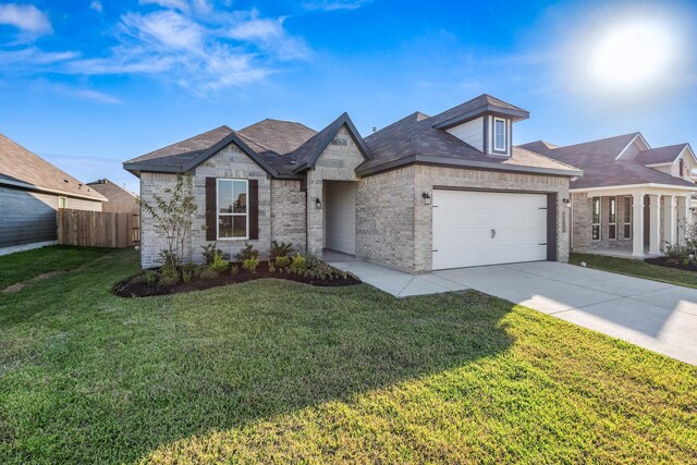 1418 Lake Ridge Dr, Brenham, TX 77833 - view of front of house featuring brick siding, a garage, and driveway