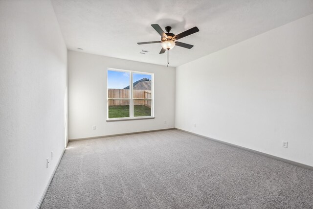 1418 Lake Ridge Dr, Brenham, TX 77833 - empty room with carpet and a ceiling fan