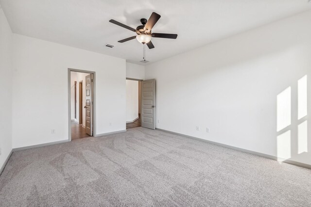 1418 Lake Ridge Dr, Brenham, TX 77833 - unfurnished bedroom with carpet and ceiling fan