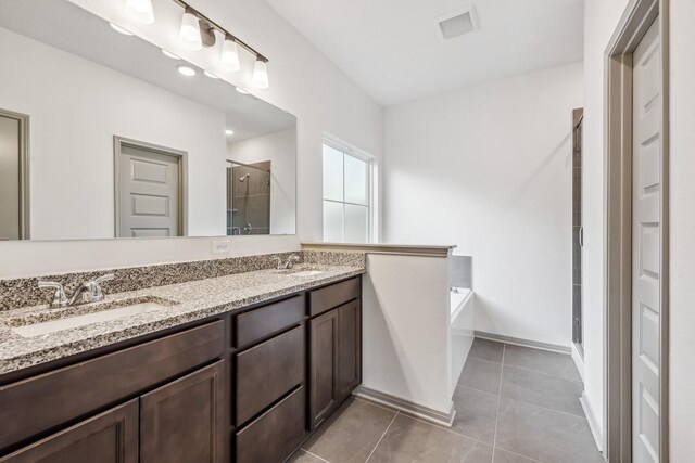 1418 Lake Ridge Dr, Brenham, TX 77833 - bathroom with a stall shower, double vanity, a bath, and tile patterned flooring