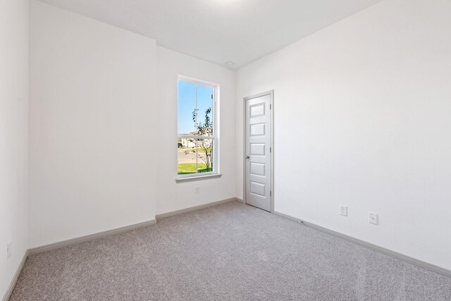 1418 Lake Ridge Dr, Brenham, TX 77833 - spare room featuring light carpet