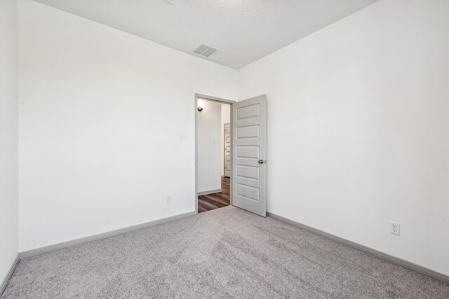1418 Lake Ridge Dr, Brenham, TX 77833 - carpeted spare room featuring baseboards