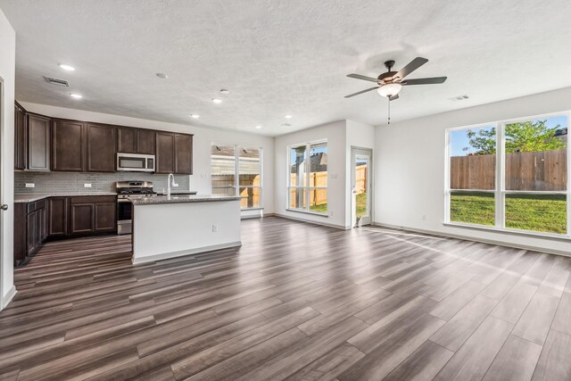 1418 Lake Ridge Dr, Brenham, TX 77833 - kitchen featuring stainless steel appliances, a ceiling fan, dark wood-type flooring, open floor plan, and recessed lighting