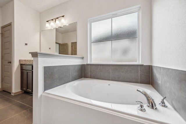 1418 Lake Ridge Dr, Brenham, TX 77833 - bathroom featuring a bath, tile patterned floors, and vanity