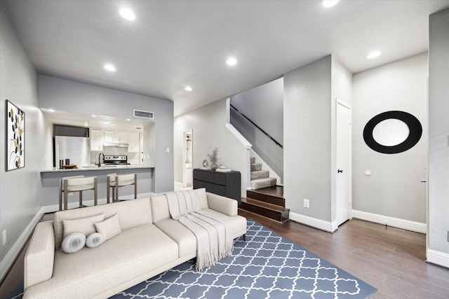 1920 Augusta Dr Unit 19, Houston, TX 77057 - living room featuring dark wood-type flooring, stairs, and recessed lighting