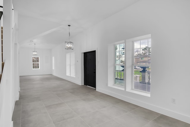 17128 Spindle Oaks Dr, Conroe, TX 77385 - foyer with a chandelier and light tile patterned floors