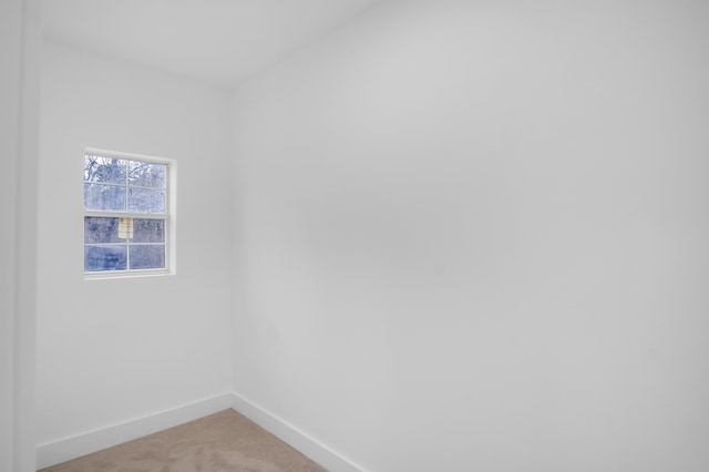 17128 Spindle Oaks Dr, Conroe, TX 77385 - spare room featuring baseboards and light colored carpet