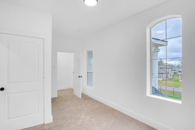 17128 Spindle Oaks Dr, Conroe, TX 77385 - spare room featuring light colored carpet and baseboards