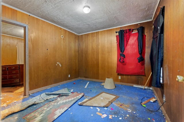 3110 Carter Blvd E, Tyler, TX 75702 - unfurnished room featuring wooden walls and a textured ceiling