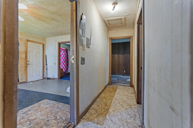 3110 Carter Blvd E, Tyler, TX 75702 - hallway featuring a textured ceiling and attic access