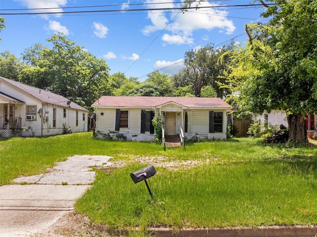 3110 Carter Blvd E, Tyler, TX 75702 - view of front of home featuring cooling unit and a front lawn