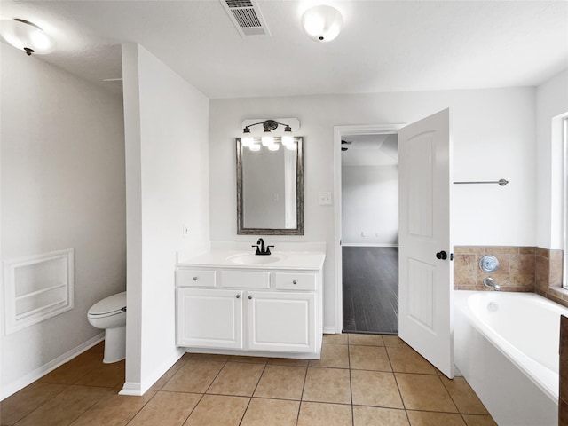 7007 Madison Trl, Houston, TX 77084 - bathroom featuring a bath, vanity, and tile patterned floors