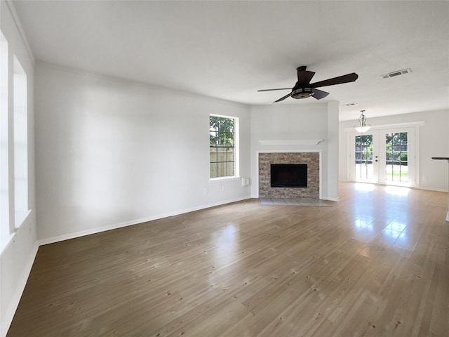 7007 Madison Trl, Houston, TX 77084 - unfurnished living room with healthy amount of natural light, ceiling fan, and wood finished floors
