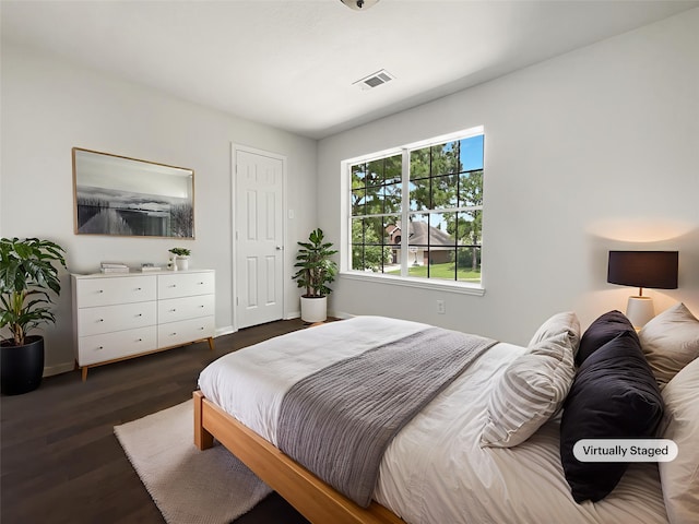 7007 Madison Trl, Houston, TX 77084 - bedroom featuring dark wood-style flooring and baseboards