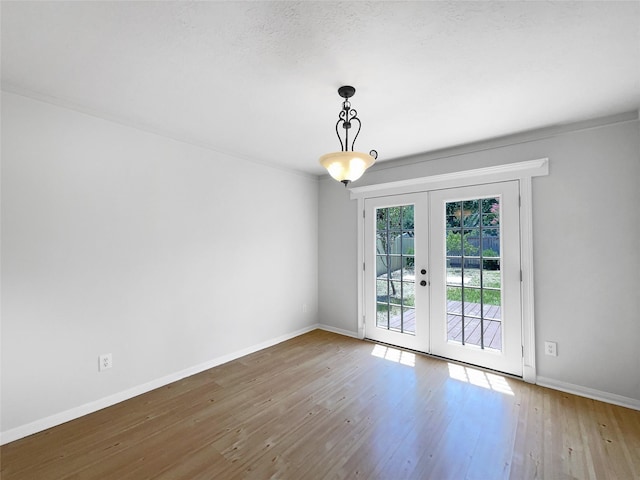 7007 Madison Trl, Houston, TX 77084 - unfurnished room featuring french doors, wood finished floors, and ornamental molding
