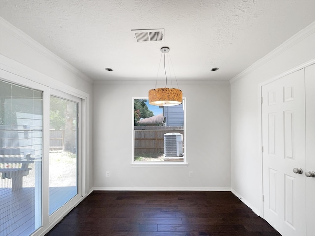 7007 Madison Trl, Houston, TX 77084 - empty room featuring healthy amount of natural light, dark wood-style flooring, a textured ceiling, and crown molding