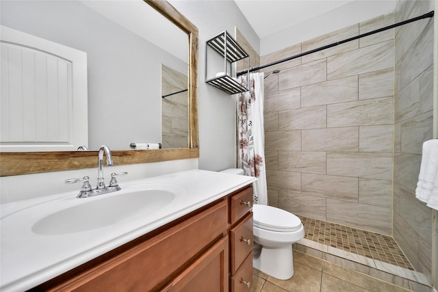 506 Glenwood Ridge Dr, Spring, TX 77386 - bathroom featuring vanity, a tile shower, and tile patterned flooring
