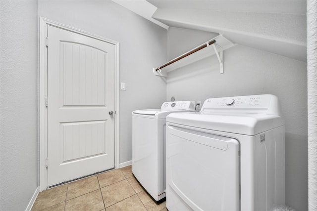 506 Glenwood Ridge Dr, Spring, TX 77386 - laundry room featuring washing machine and clothes dryer and light tile patterned floors
