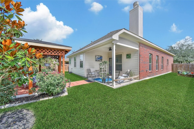 506 Glenwood Ridge Dr, Spring, TX 77386 - back of property with ceiling fan, a fenced backyard, a patio area, and a chimney