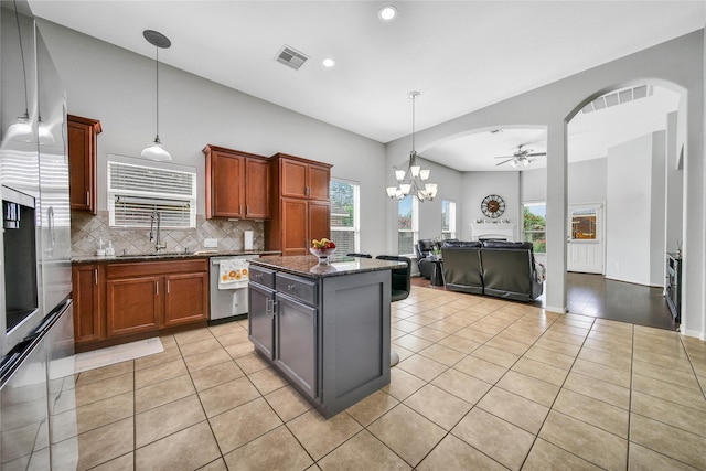 506 Glenwood Ridge Dr, Spring, TX 77386 - kitchen featuring appliances with stainless steel finishes, light tile patterned floors, ceiling fan, backsplash, and recessed lighting
