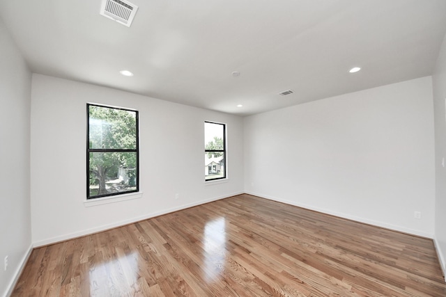 4541 Walker St, Houston, TX 77023 - spare room featuring light wood-style floors and recessed lighting