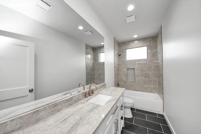 4541 Walker St, Houston, TX 77023 - full bath featuring tile patterned floors, vanity, recessed lighting, and shower / bathtub combination