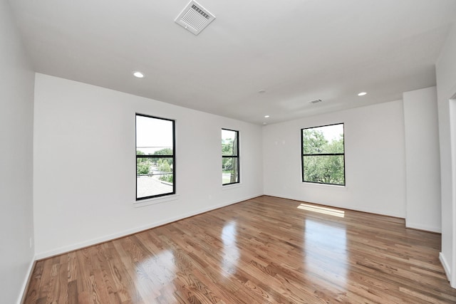 4541 Walker St, Houston, TX 77023 - empty room featuring light wood-type flooring and recessed lighting
