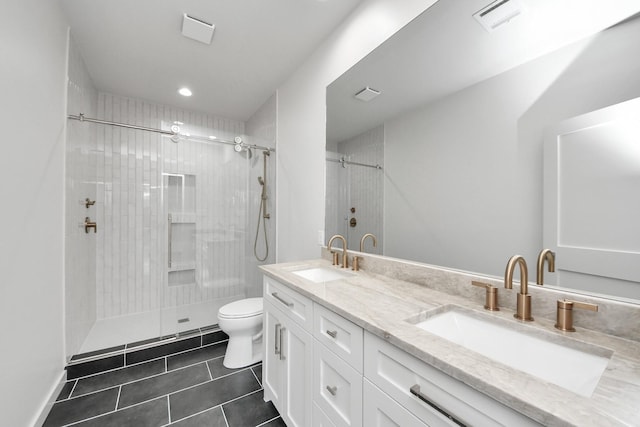 4541 Walker St, Houston, TX 77023 - full bathroom featuring tile patterned flooring, a tile shower, double vanity, and recessed lighting