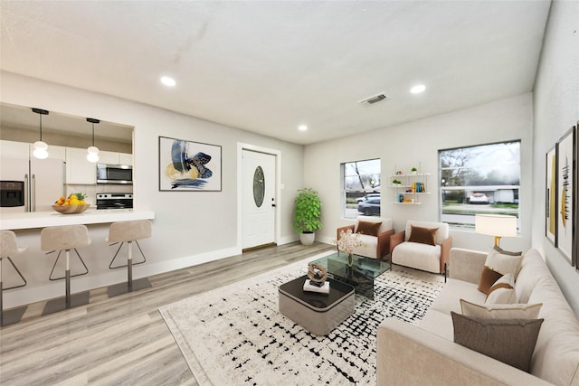 5817 Beechnut St, Houston, TX 77074 - living room featuring light wood-type flooring and recessed lighting
