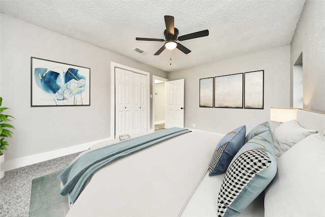 5817 Beechnut St, Houston, TX 77074 - bedroom with carpet flooring, a closet, a ceiling fan, and a textured ceiling