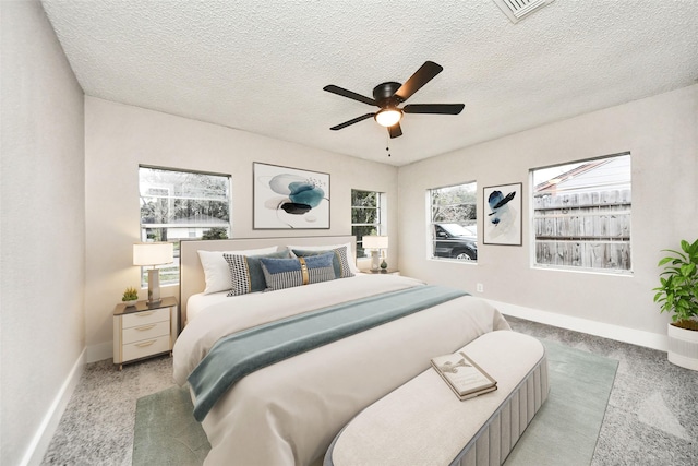 5817 Beechnut St, Houston, TX 77074 - bedroom featuring light carpet, a textured ceiling, and ceiling fan