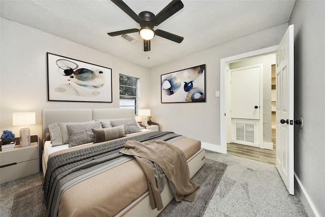 5817 Beechnut St, Houston, TX 77074 - carpeted bedroom featuring a ceiling fan and a textured ceiling
