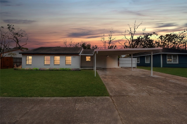 5817 Beechnut St, Houston, TX 77074 - view of front of property featuring concrete driveway, a yard, and an attached carport