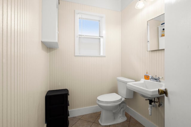 213 E Feagin St, Livingston, TX 77351 - half bathroom featuring toilet and tile patterned floors