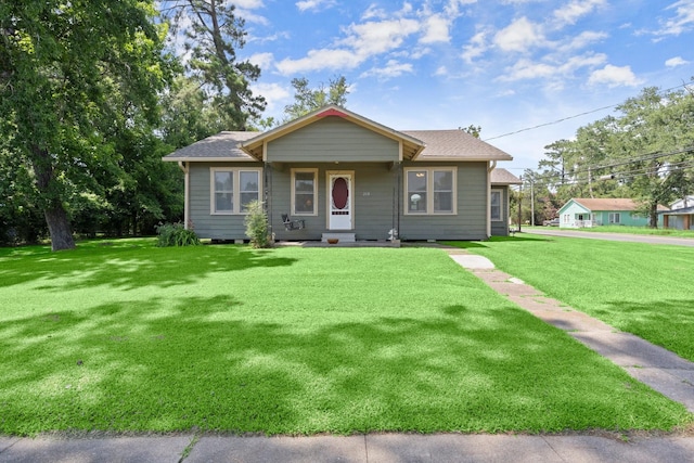 213 E Feagin St, Livingston, TX 77351 - bungalow-style home featuring a front yard