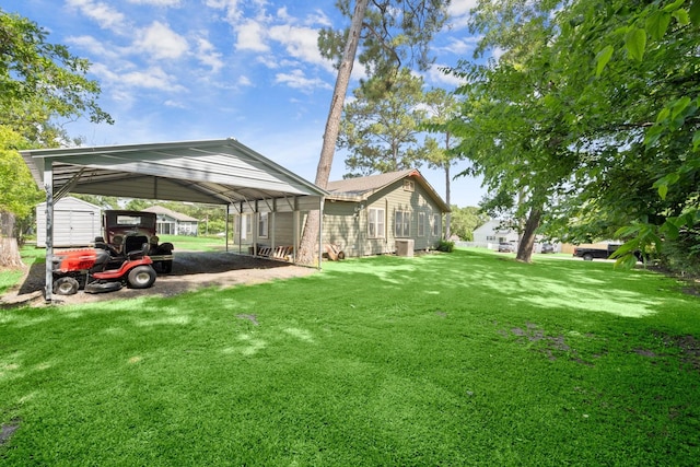213 E Feagin St, Livingston, TX 77351 - view of green lawn with a detached carport and a storage shed