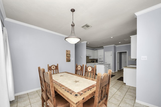 2613 Broussard Ct, Seabrook, TX 77586 - dining area featuring light tile patterned flooring, ornamental molding, and recessed lighting