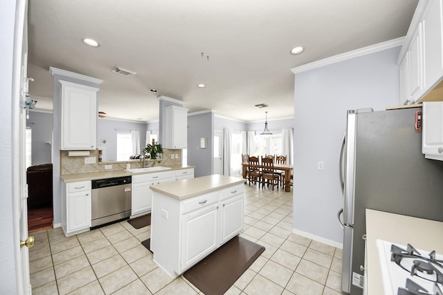 2613 Broussard Ct, Seabrook, TX 77586 - kitchen with stainless steel appliances, light countertops, tasteful backsplash, light tile patterned flooring, and crown molding