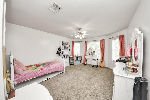 2613 Broussard Ct, Seabrook, TX 77586 - bedroom featuring light colored carpet and a ceiling fan