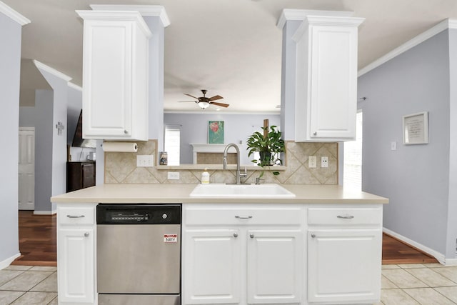 2613 Broussard Ct, Seabrook, TX 77586 - kitchen featuring stainless steel dishwasher, ceiling fan, light countertops, light tile patterned flooring, and ornamental molding