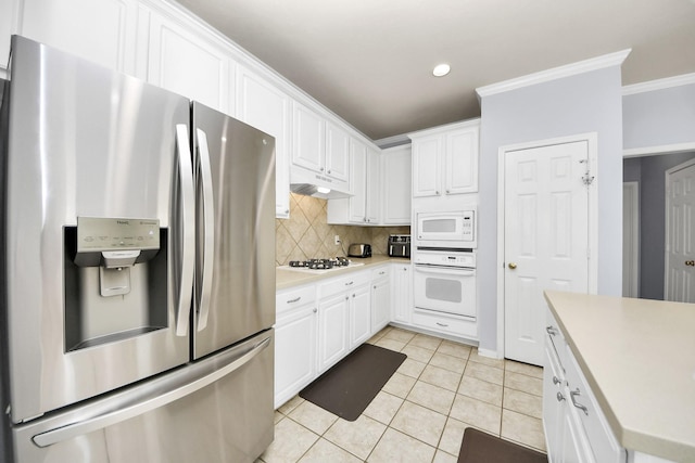 2613 Broussard Ct, Seabrook, TX 77586 - kitchen featuring white appliances, ornamental molding, white cabinetry, light countertops, and backsplash