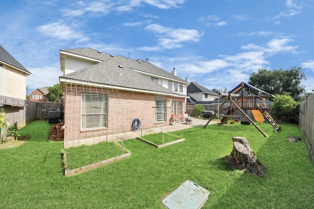 2613 Broussard Ct, Seabrook, TX 77586 - rear view of property featuring a playground, a fenced backyard, a patio area, a shingled roof, and brick siding