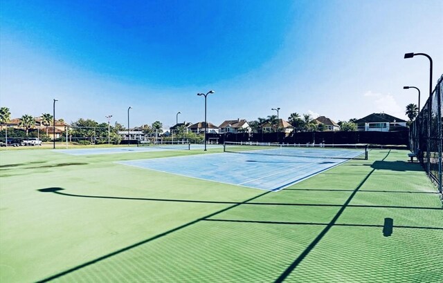 2613 Broussard Ct, Seabrook, TX 77586 - view of tennis court featuring community basketball court
