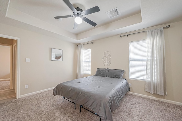 2335 Village Leaf Dr, Spring, TX 77386 - bedroom with a raised ceiling, carpet flooring, and ceiling fan