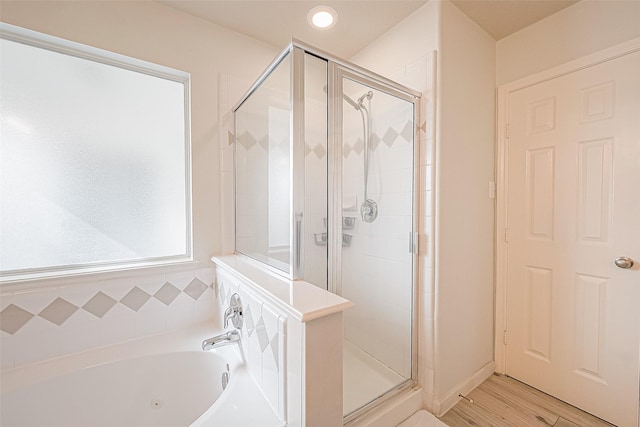 2335 Village Leaf Dr, Spring, TX 77386 - full bath with a shower stall, a tub with jets, and wood finished floors