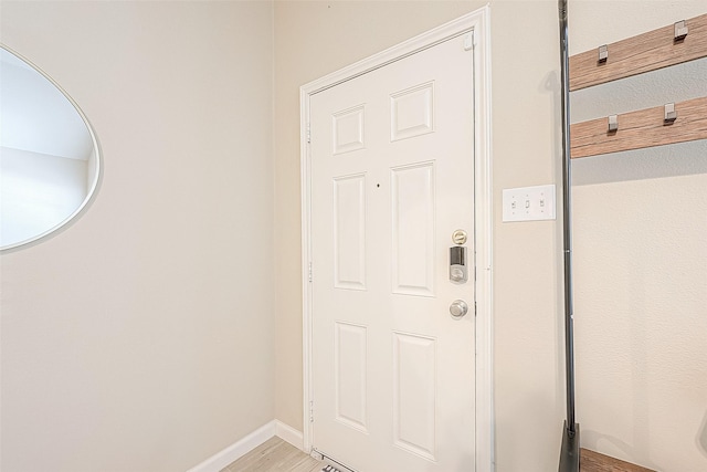 2335 Village Leaf Dr, Spring, TX 77386 - doorway featuring baseboards and light wood finished floors