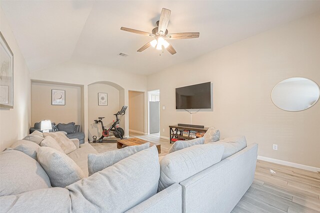 2335 Village Leaf Dr, Spring, TX 77386 - living room featuring ceiling fan, light wood-type flooring, arched walkways, and vaulted ceiling