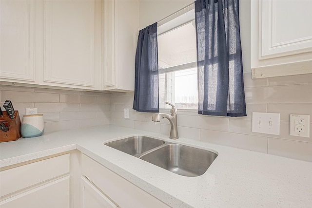 2335 Village Leaf Dr, Spring, TX 77386 - kitchen with decorative backsplash and white cabinets