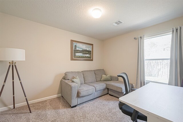 2335 Village Leaf Dr, Spring, TX 77386 - living area with light colored carpet and a textured ceiling