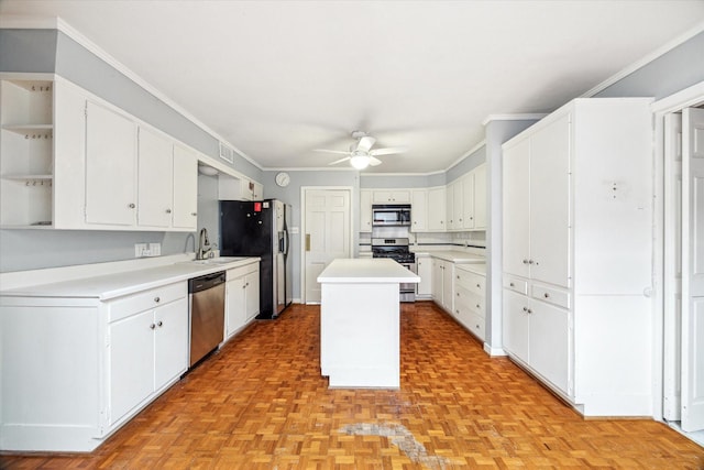 7525 Middlewood St, Houston, TX 77063 - kitchen with appliances with stainless steel finishes, open shelves, white cabinets, a ceiling fan, and ornamental molding